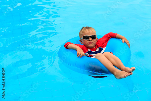 little boy having fun in the swimming pool