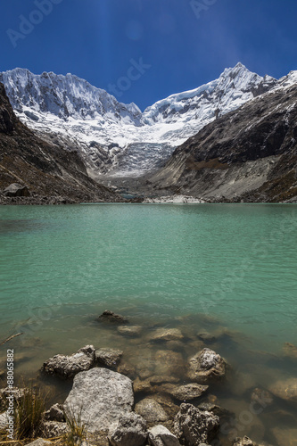 Llaca lagoon in the peruvian Andes and Ocshapalpa peak and Ranra