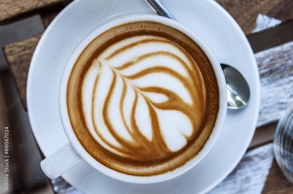 Cup of freshly made espresso on wood board Cup of freshly made espresso on wood board