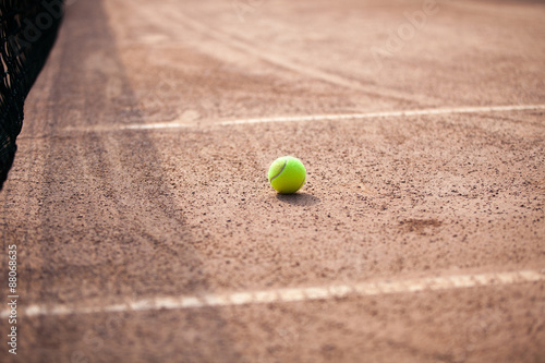 Player's hand with tennis ball preparing to serve