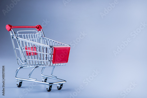 Shopping trolley. Shopping cart. Shopping trolley on muti collored background. Free space for your informations