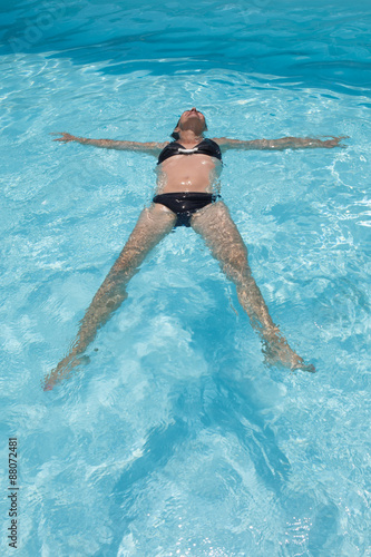 Female swimmer in an outdoor swimming pool