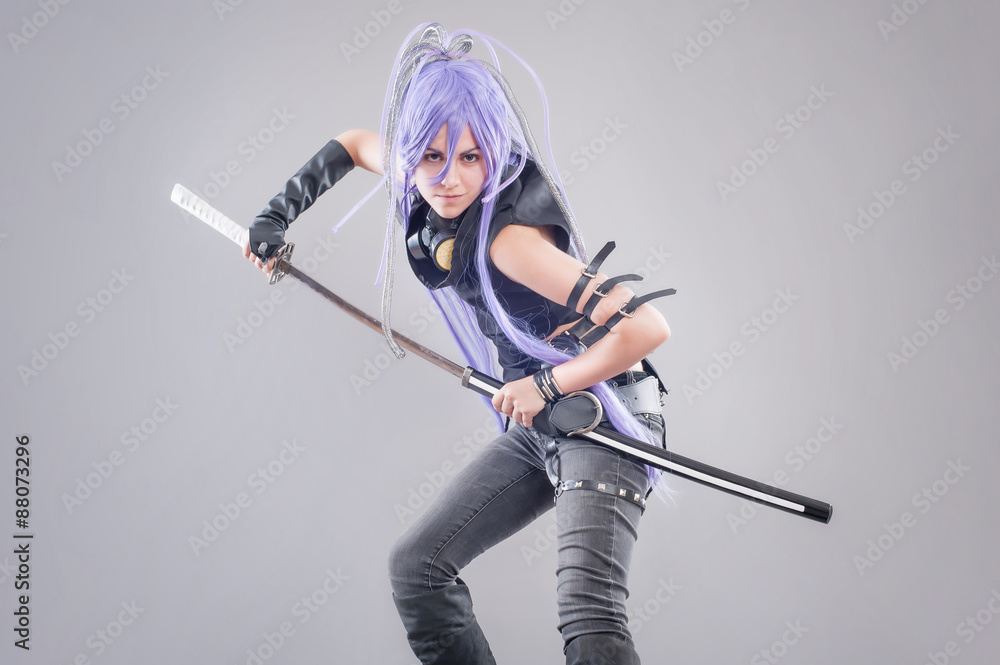 Female fantasy warrior / Female warrior with sword isolated on the gray background Female fantasy warrior / Female warrior with sword isolated on the gray background