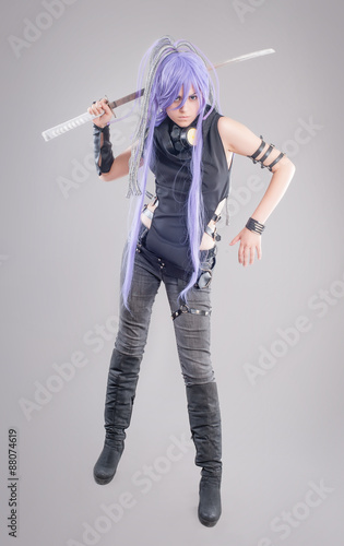 Foto Female fantasy warrior / Female warrior with sword isolated on the gray backgrou