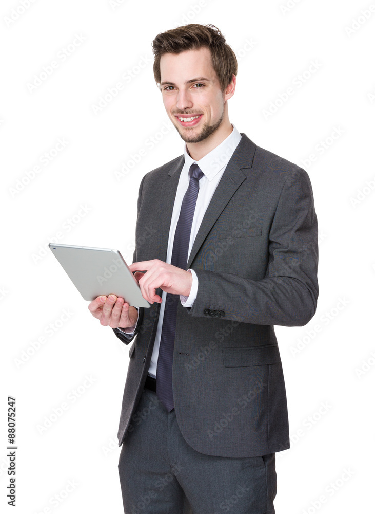 Confident businessman use of tablet pc