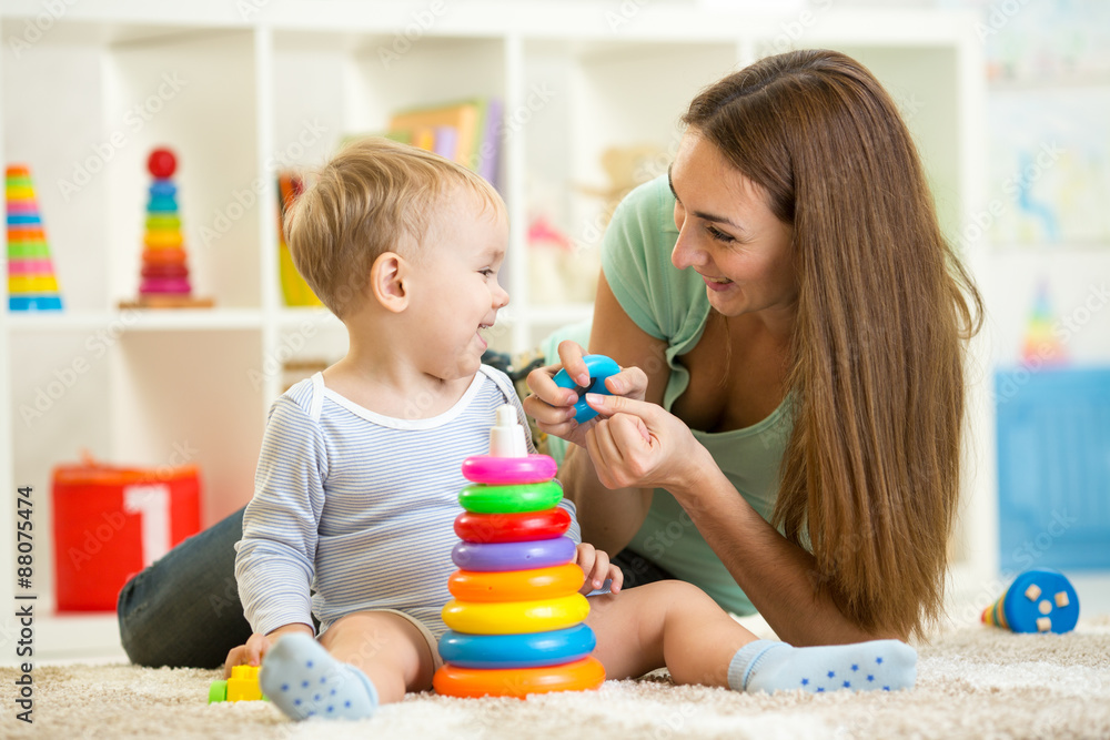 cute mother and child boy play together indoor at home cute mother and child boy play together indoor at home