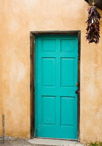 Distinctive blue door with hanging red peppers in Old Town © F&J McGinn