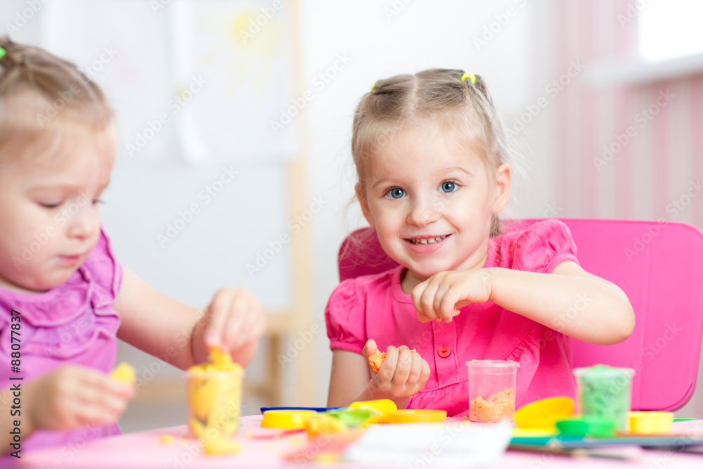 Fototapeta premium children playing with colorful clay
