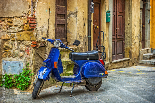 Scooter in the street in the old town of Tuscany