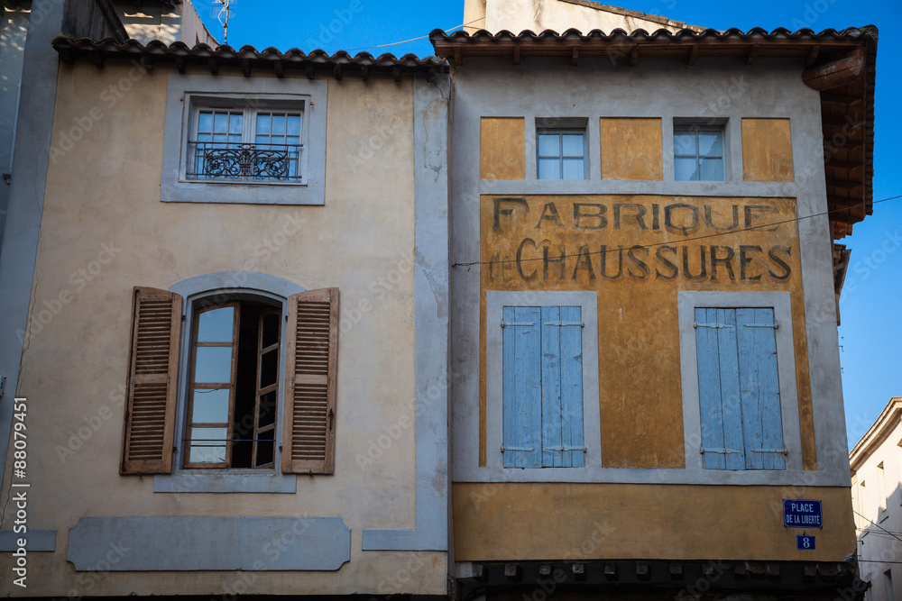 House facades in the old town of L'Isle sur la Sorgue in Provence
