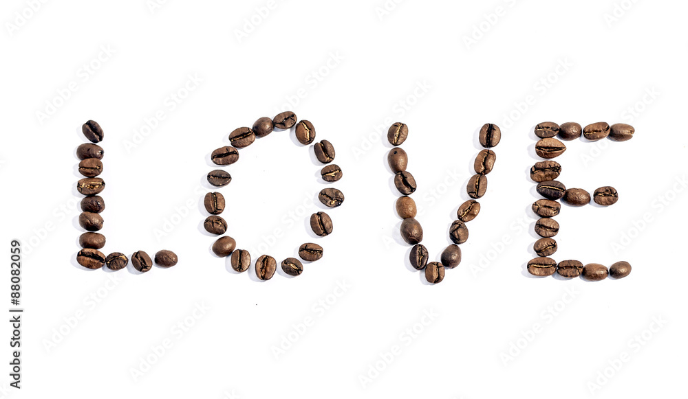 The word love writen with coffee beans on white background The word love writen with coffee beans on white background