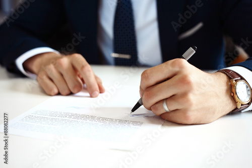 Fotografie Businessman signing a document.