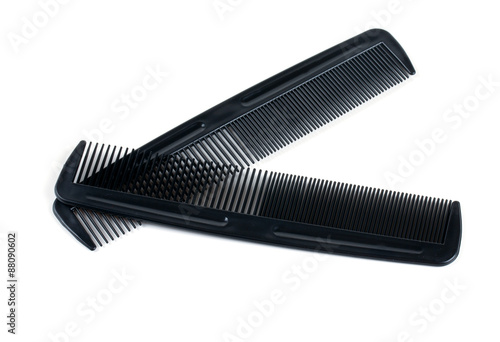 two black combs for hair isolated on white