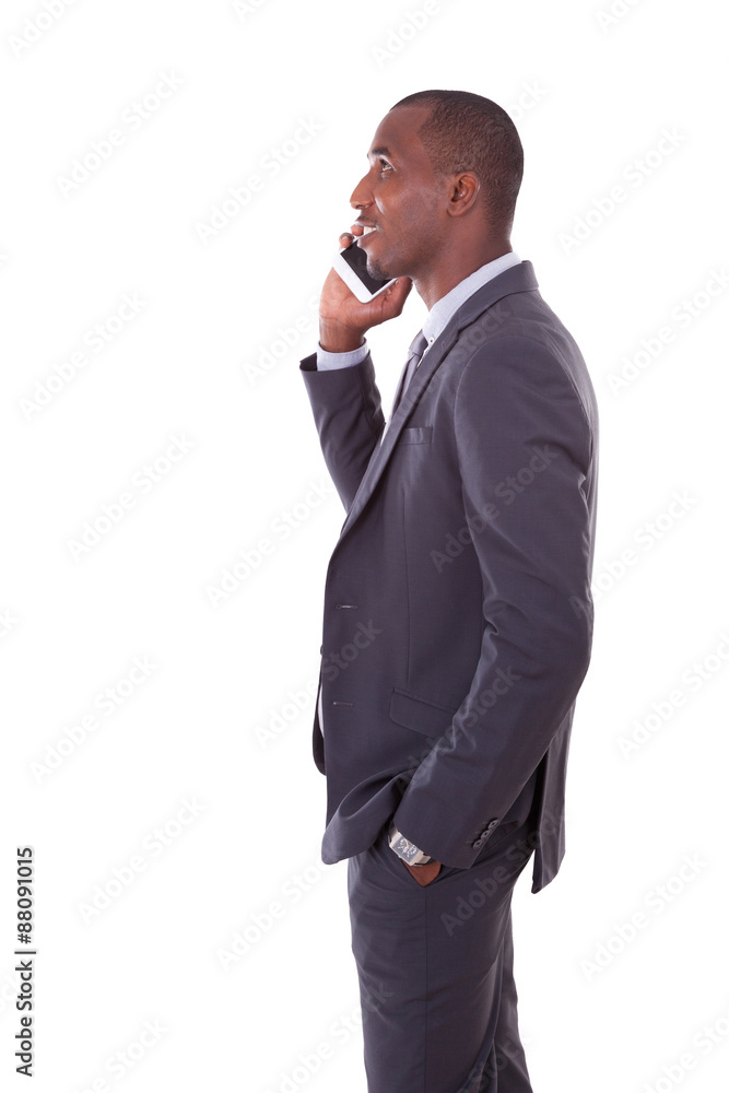 Portrait of a young African American business man making a mobil Portrait of a young African American business man making a mobil