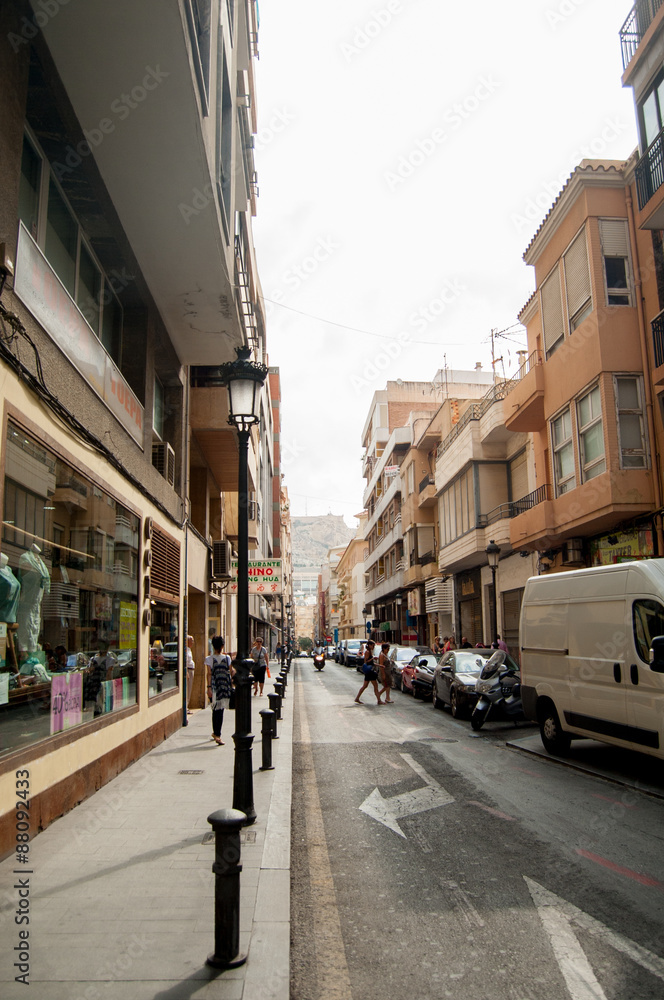 ALICANTE, SPAIN - JULY 14, 2015: Old street with city hall in sp