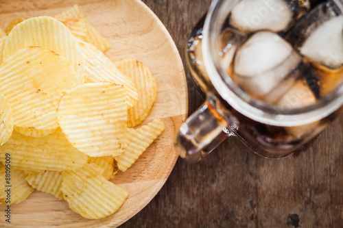 Crispy potato chips with iced cola