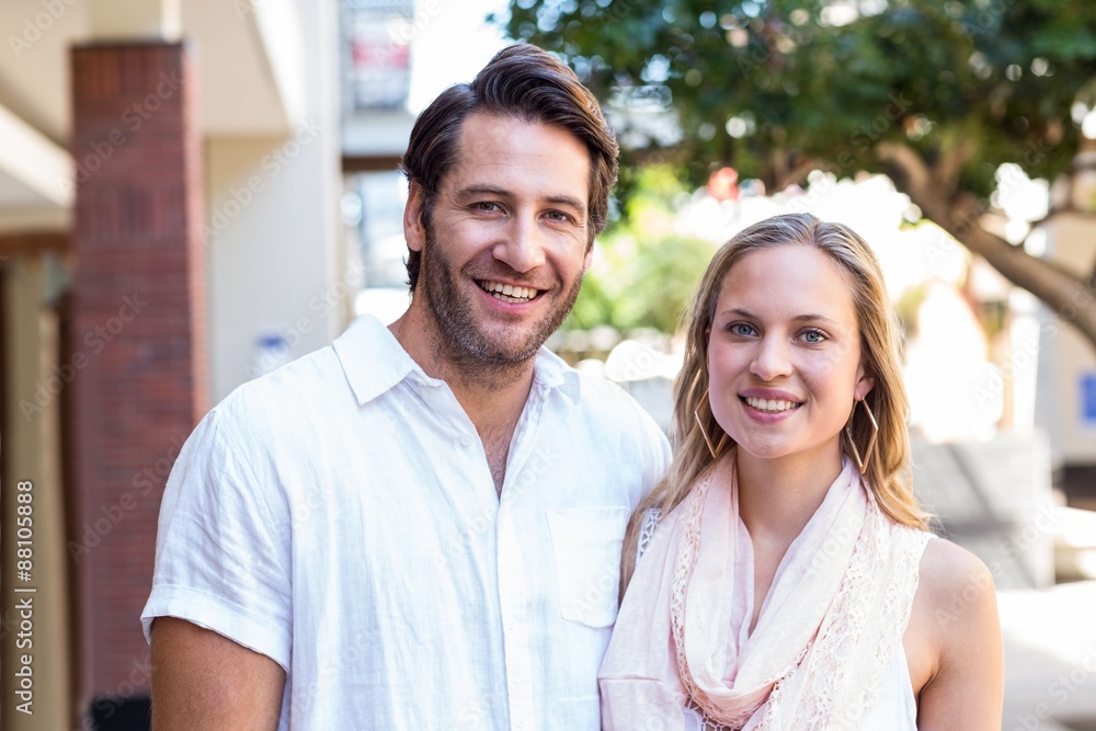 Smiling couple looking at camera