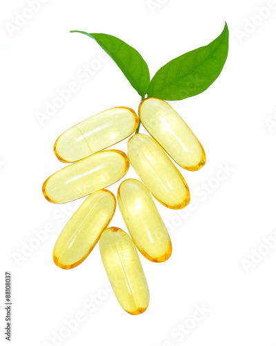 shiny yellow vitamin e fish oil capsule isolated on white backgr