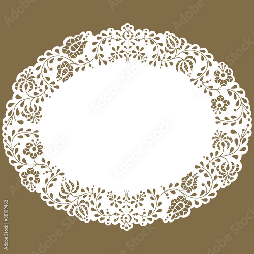 Oval paper lace edged doily made with Hungarian embroidery pattern