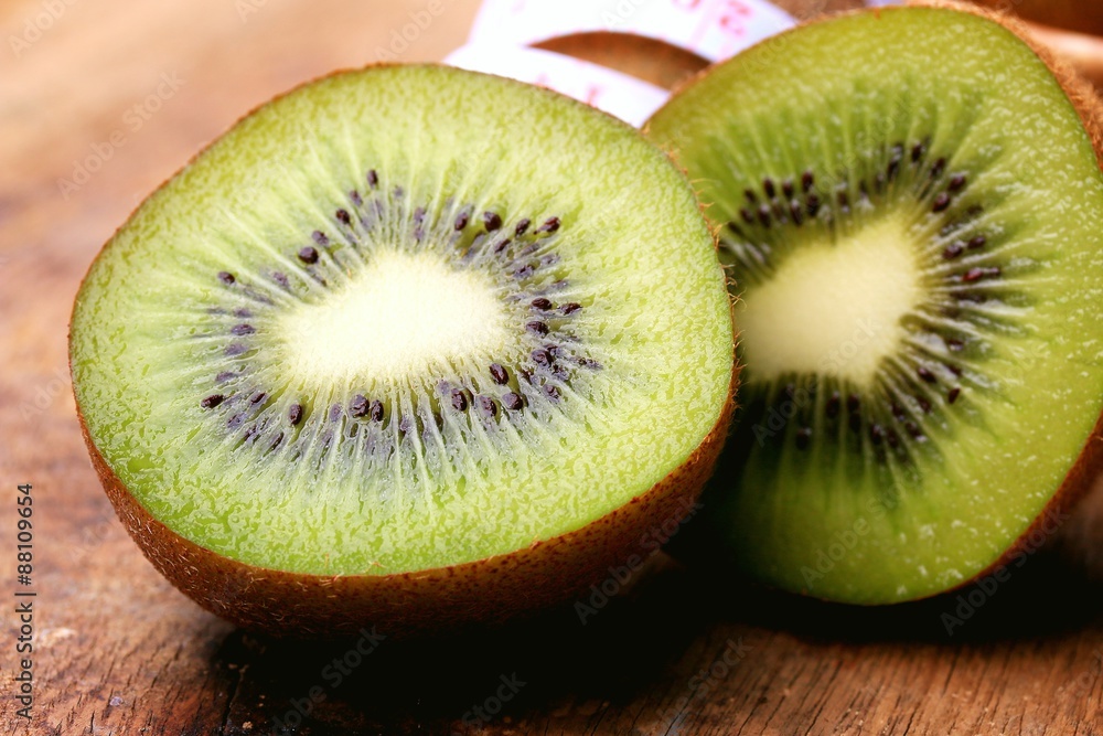fresh kiwi fruit and tape measure fresh kiwi fruit and tape measure