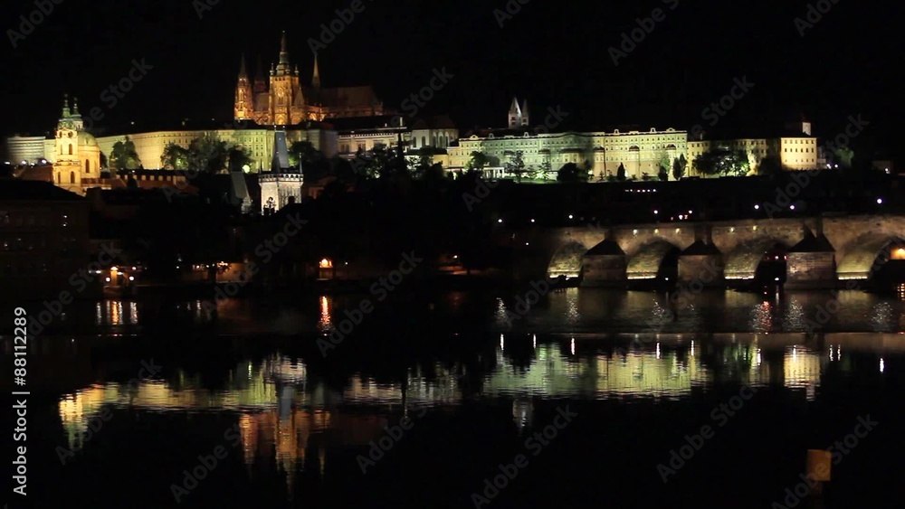 Reflection of Prague caste and the Charles bridge at dusk Reflection of Prague caste and the Charles bridge at dusk