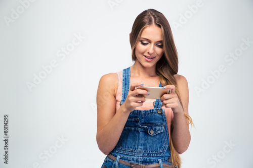 Portrait of a happy woman using smartphone