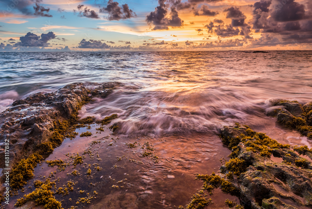 Fototapeta premium sea waves lash line impact rock on the beach