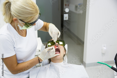 Dentist using a modern diode dental laser