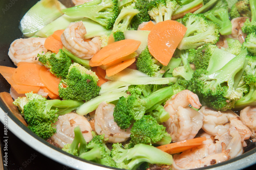 Stir fried broccoli with shrimp in pan Stir fried broccoli with shrimp in pan