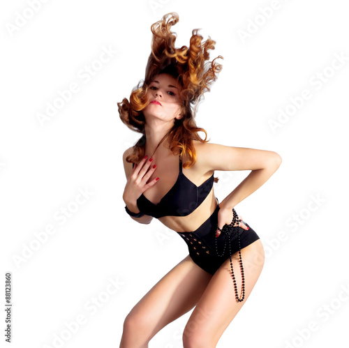 Sexy young woman dancing  hair flying