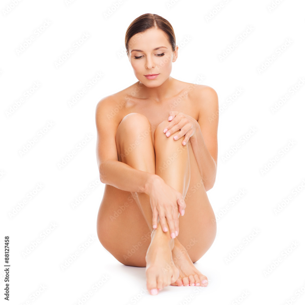 Obraz premium beautiful naked woman touching her legs