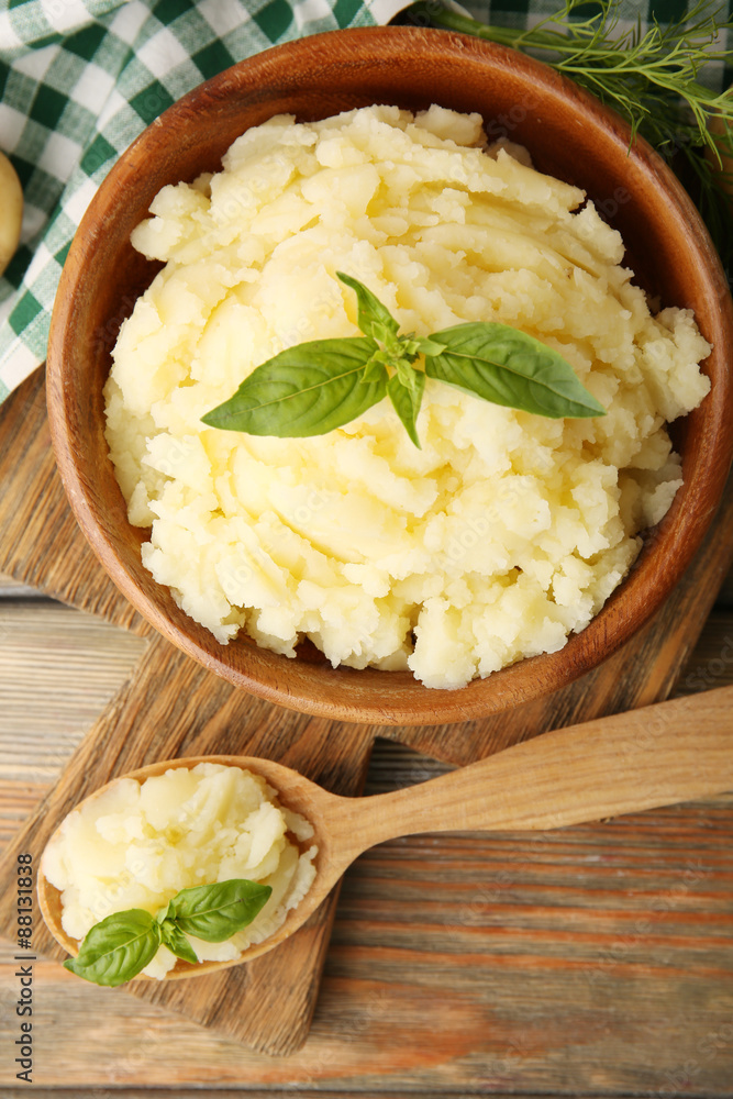Mashed potatoes in bowl on wooden table, top view Mashed potatoes in bowl on wooden table, top view