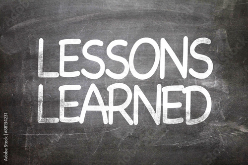 Fotografie Lessons Learned written on a chalkboard