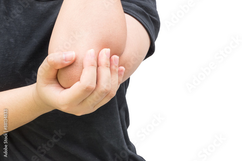 Canvas Print Woman holds a painful elbow with isolated background.