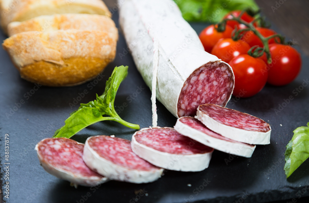 Salami bread with basil and cherry tomatoes Salami bread with basil and cherry tomatoes