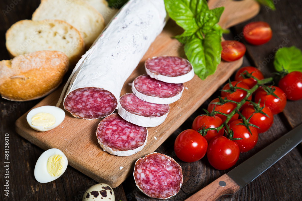 Salami bread with basil and cherry tomatoes Salami bread with basil and cherry tomatoes