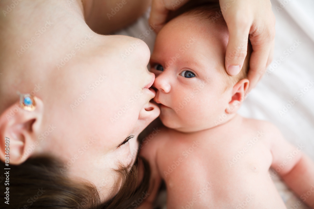 Mother and her one month old son close up Mother and her one month old son close up