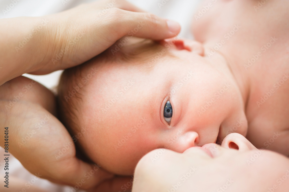 Mother and her one month old son close up Mother and her one month old son close up
