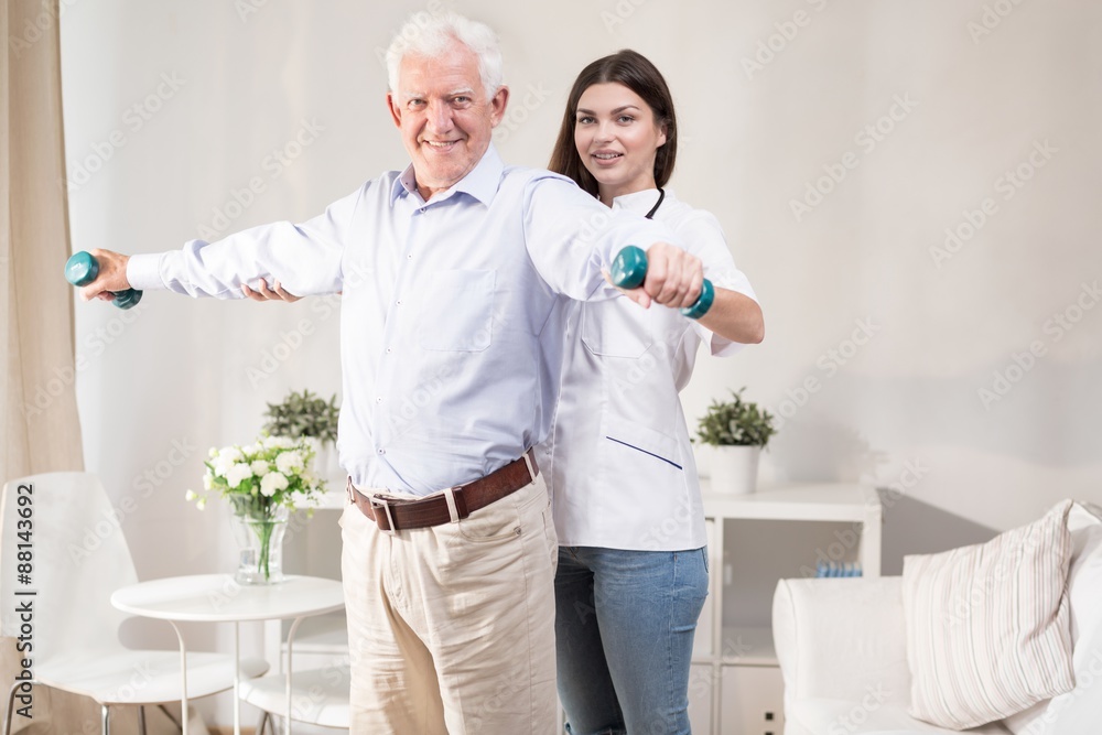 Fototapeta premium Senior man training with dumbbells