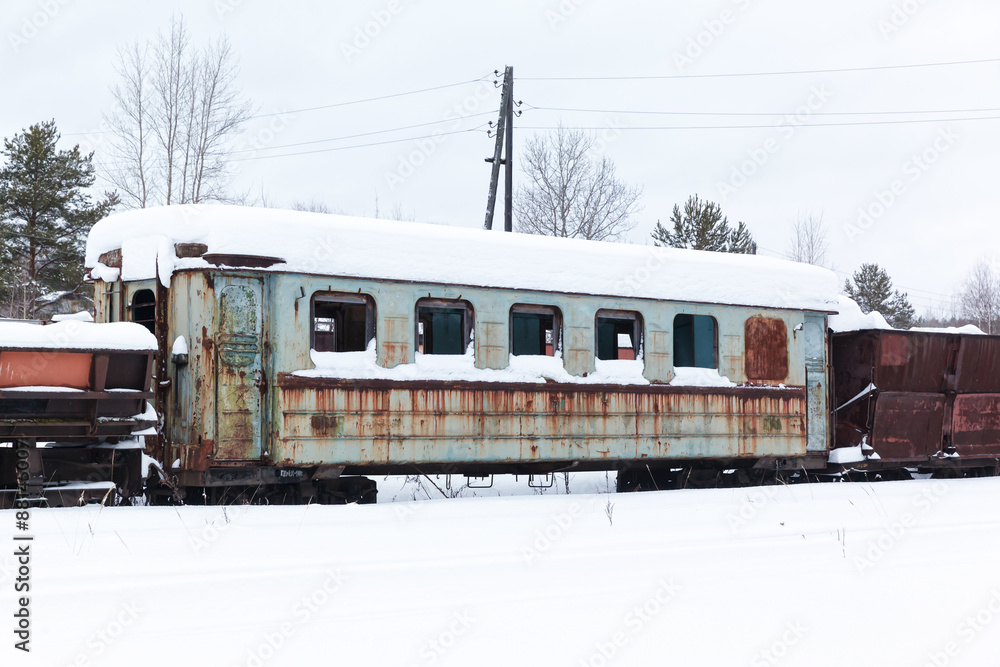 Abandoned rusty wagons on narrow-gauge railway Abandoned rusty wagons on narrow-gauge railway
