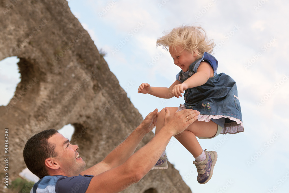 Fototapeta premium Happy family fun on field with haystacks
