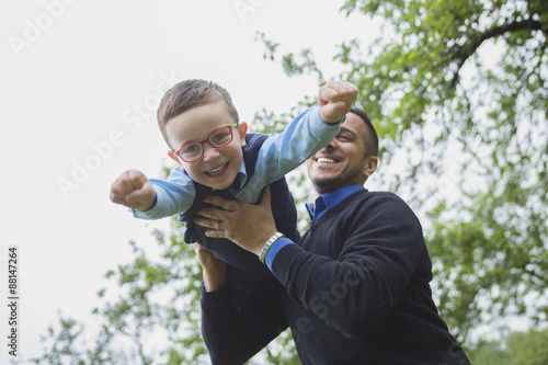 Father and son in forest on a meadow © Louis-Photo