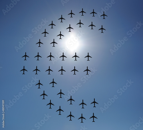 Airplane silhouettes in the sky