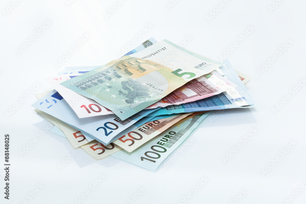 Pile of European Union Currency on white
