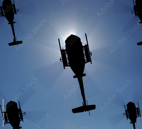 Helicopter silhouette in the sky