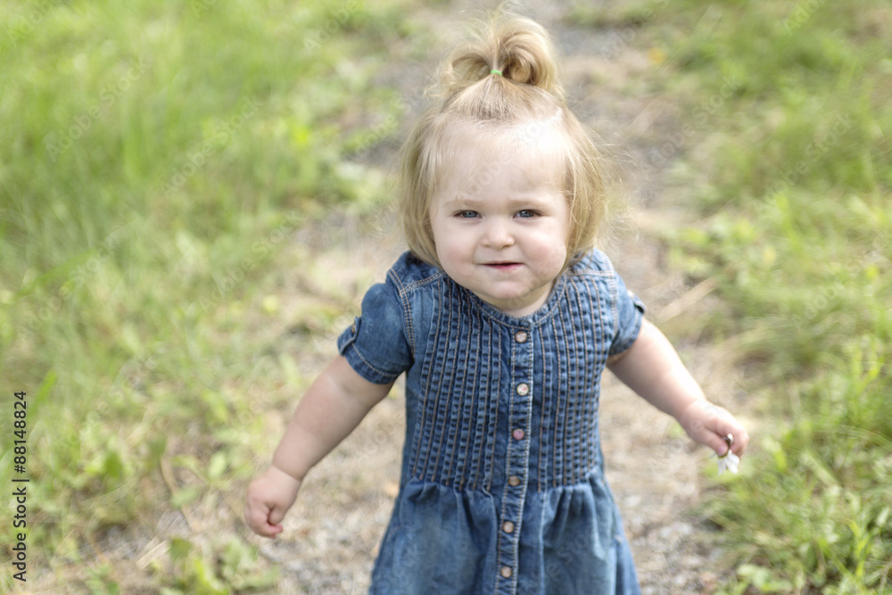 Adorable little girl in the forest meadow Adorable little girl in the forest meadow