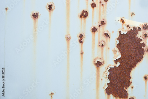 Light blue sheet metal plate with rust spots and stains. photo