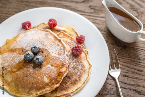 Pancakes with maple syrup and fresh berries