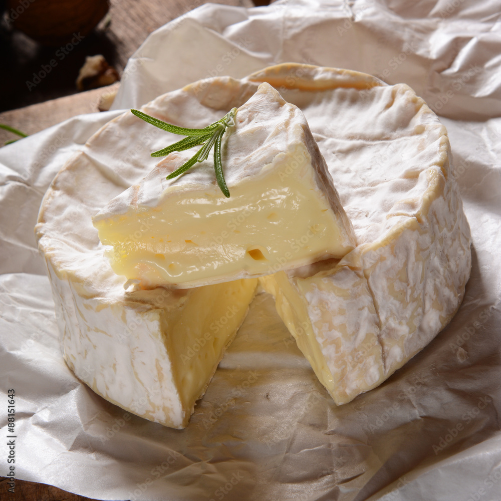 Camembert cheese on a rustic background Camembert cheese on a rustic background