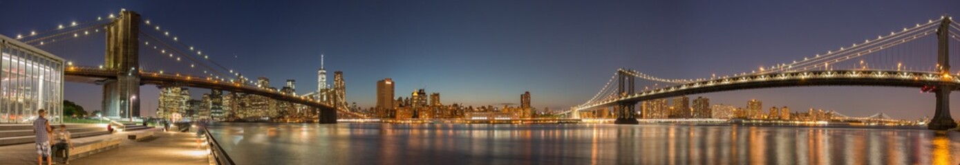 Panoramic View Manhattan Bridge, Brooklyn Bridge and Manhattan Skyline at night